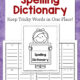 Cover of a children's spelling dictionary kit: title 'My Spelling Dictionary' with a smiling girl holding a sign, and background of alphabet worksheets on a purple border.